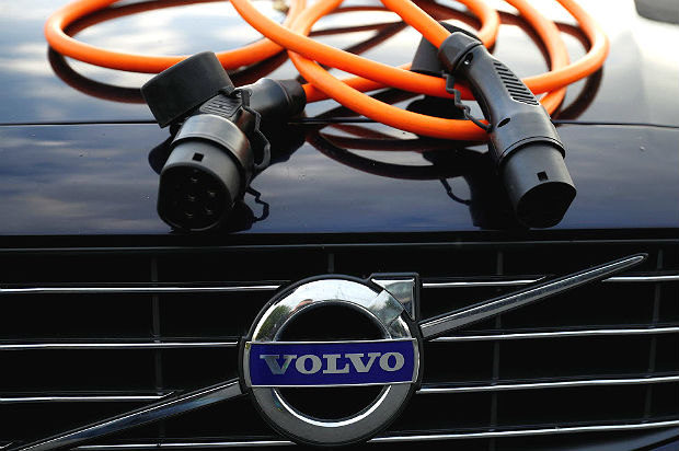 An electric vehicle charging cable is seen on the bonnet of a Volvo hybrid car in this picture illustration taken July 6, 2017. REUTERS/Phil Noble/Illustration ORG XMIT: PNN01