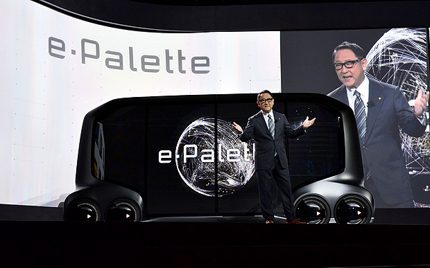 Toyota Motor Corporation President Akio Toyoda announces the e-Palette during the Toyota press conference at the Mandalay Bay Convention Center during CES 2018 in Las Vegas on January 8, 2018. / AFP PHOTO / MANDEL NGAN ORG XMIT: MNN010