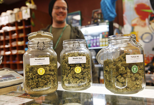 Jars of marijuana buds sit on the counter at the Denver Kush Club early Friday, Nov. 27, 2015, in north Denver. More than two dozen customers took advantage of a new Colorado holiday tradition of marijuana shops drawing customers with discounted weed and holiday gift sets. (AP Photo/David Zalubowski) ORG XMIT: CODZ103