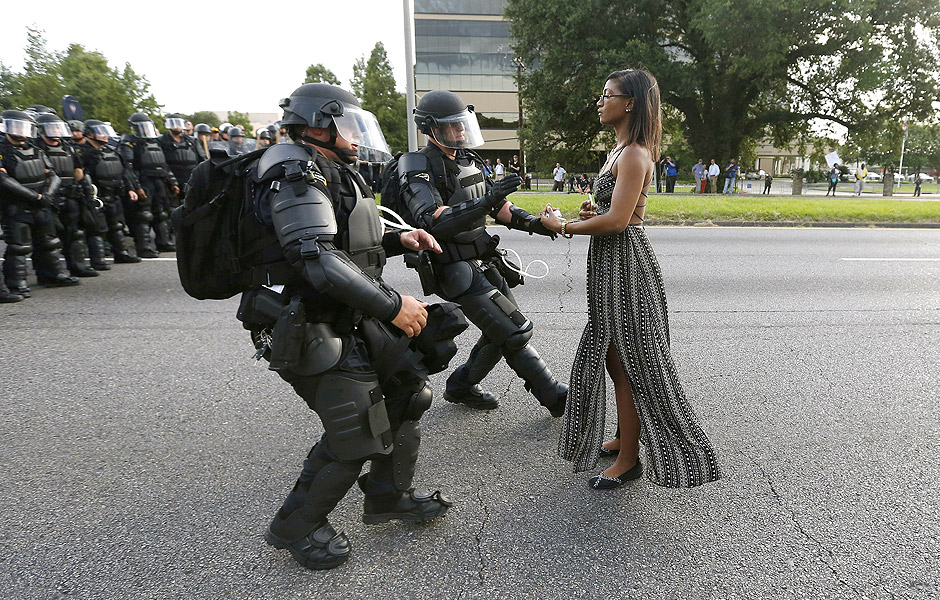 FILE PHOTO - A demonstrator protesting the shooting death of Alton Sterling is detained by law enforcement near the headquarters of the Baton Rouge Police Department in Baton Rouge, Louisiana, U.S. July 9, 2016. REUTERS/Jonathan Bachman/File Photo REUTERS PICTURES OF THE YEAR 2016 - SEARCH 'POY 2016' TO FIND ALL IMAGES ORG XMIT: POY047