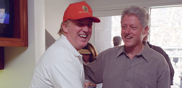 Donald Trump (L) laughs with then U.S. President Bill Clinton at the U.S. Open in Flushing, New York, U.S in this September 8, 2000 handout photo. Courtesy William J. Clinton Presidential Library/Handout via REUTERS ATTENTION EDITORS - THIS IMAGE WAS PROVIDED BY A THIRD PARTY. EDITORIAL USE ONLY. ORG XMIT: WAS101