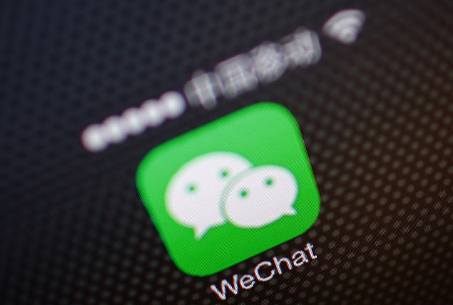 A picture illustration shows a WeChat app icon in Beijing, December 5, 2013. An unprecedented Nov. 14 leak of China's Communist Party reform plans fuelled China's biggest stock market rally in two months as it spread on microblogs and passed from smartphone to smartphone on WeChat, a three-year-old social messaging app developed by Tencent Holdings Ltd. WeChat, or Weixin in Chinese, meaning "micromessage", leapt from 121 million global monthly active users at the end of September 2012 to 272 million in just a year. It has quickly become the news source of choice for savvy mobile users in China, where a small army of censors scrub the country's Internet of politically sensitive news and "harmful" speech. Picture taken December 5, 2013. REUTERS/Petar Kujundzic (CHINA - Tags: BUSINESS POLITICS TELECOMS) ORG XMIT: PEK05