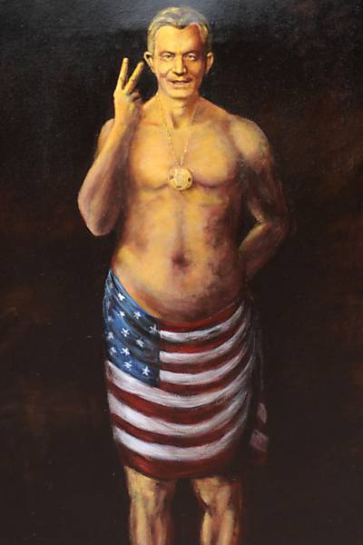 Manifestante segura pôster com a imagem do ex-primeiro-ministro britânico Tony Blair durante protesto em Londres, Inglaterra