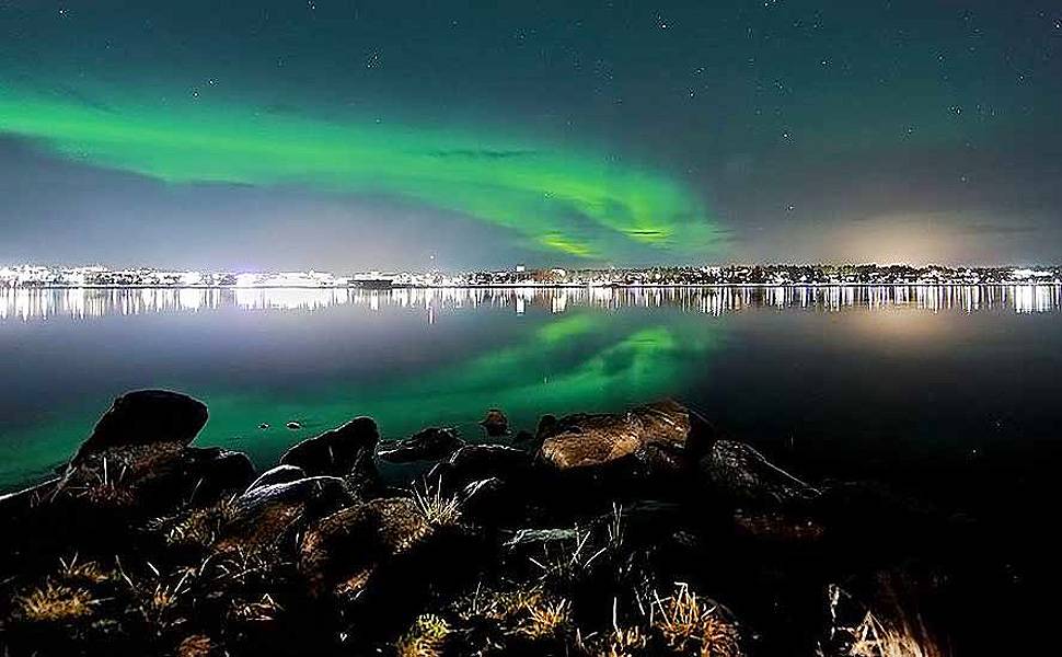 Turistas viram 'caçadores' de aurora boreal