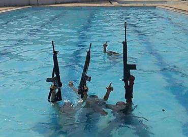 Drug Traffickers Pose With Rifles at Olympic Village Pool