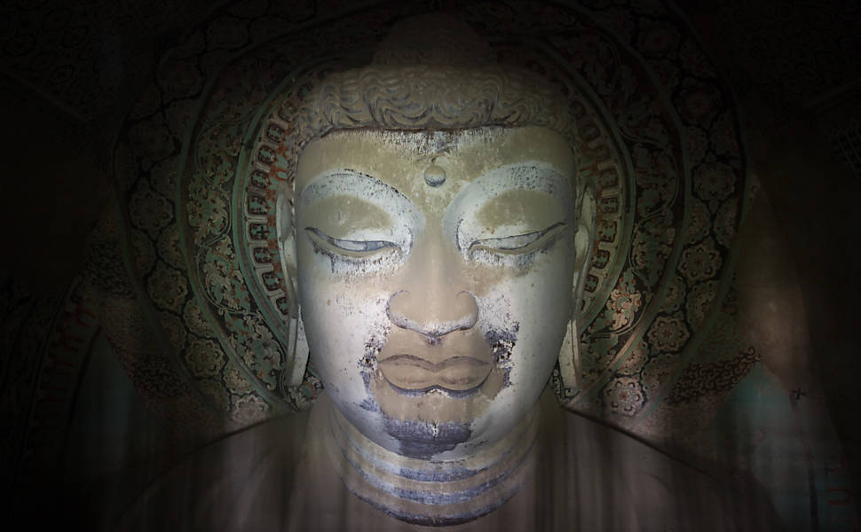Cavernas na China escondem obras budistas milenares