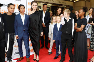 Jolie arrives on the red carpet with her children or the film 