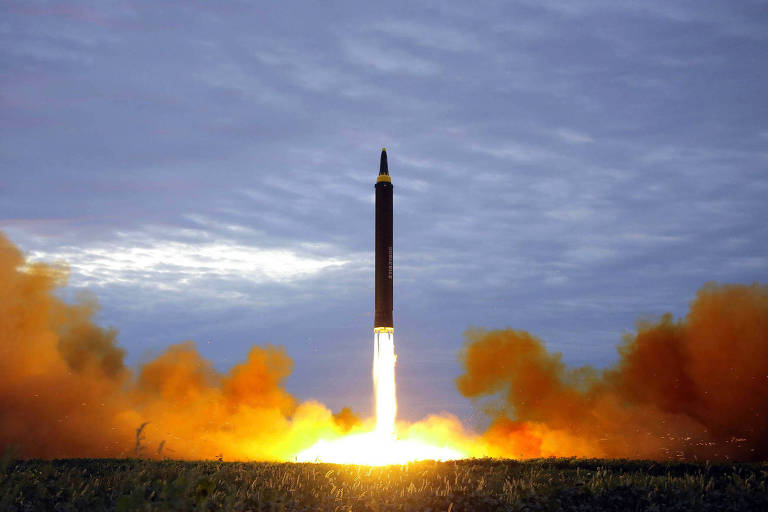 FILE - This Aug. 29, 2017 file photo distributed on Aug. 30, 2017, by the North Korean government shows what was said to be the test launch of a Hwasong-12 intermediate range missile in Pyongyang, North Korea. Japan is debating whether to develop limited pre-emptive strike capability and buy cruise missiles - ideas that were anathema in the pacifist country before the North Korea missile threat. North Korea?s test-firing of a missile on Aug. 29, 2017, which flew over Japan and landed in the northern Pacific Ocean, quickly reactivated the debate at parliament and in the media. (Korean Central News Agency/Korea News Service via AP, File)