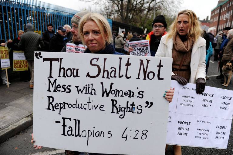 This file photo taken on November 24, 2012 shows A protestor displays a banner against Ireland's abortion laws during a march against Government austerity measures in Dublin, Ireland. Ireland will hold a referendum next year on whether to repeal its constitutional ban on abortion in almost all cases, Prime Minister Leo Varadkar's government announced on September 26, 2017. / AFP PHOTO / BARRY CRONIN ORG XMIT: 450