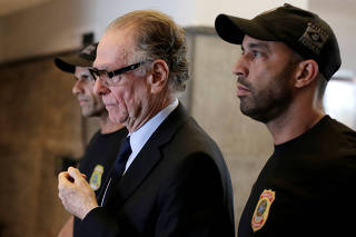Brazilian Olympic Committee (COB) President Carlos Arthur Nuzman leaves the Federal Police headquarters heading to jail, in Rio de Janeiro