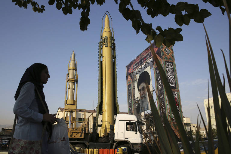 In this Sunday, Sept. 24, 2017 file photo, a Ghadr-H missile, center, a solid-fuel surface-to-surface Sejjil missile and a portrait of the Supreme Leader Ayatollah Ali Khamenei are displayed at Baharestan Square in Tehran, Iran, for the annual Defense Week which marks the 37th anniversary of the 1980s Iran-Iraq war. Iran's paramilitary Revolutionary Guard faces new sanctions from U.S. President Donald Trump as he has declined to re-certify the nuclear deal between Tehran and world powers. But what is this organization? (AP Photo/Vahid Salemi, File) ORG XMIT: TEH101