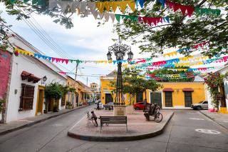 View of a small colorful plaza tucked away in the Getsemani neighborhood of Cartagena, Colombia.