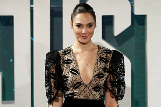 Actor Gal Gadot poses for photographers at the Justice League photocall, at The College, in London