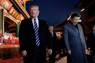 U.S. President Donald Trump and China's President Xi Jinping leave after an opera performance at the Forbidden City in Beijing