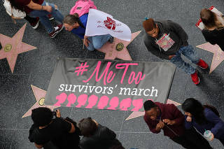 Women take part in a #MeToo protest march for survivors of sexual assault and their supporters in Hollywood, Los Angeles