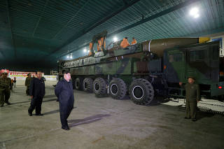 FILE PHOTO: North Korean leader Kim Jong Un inspects the intercontinental ballistic missile Hwasong-14 in this undated photo released by KCNA