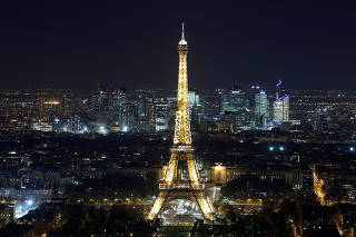 A general view shows the Eiffel Tower and the financial and business district in La Defense, west of Paris