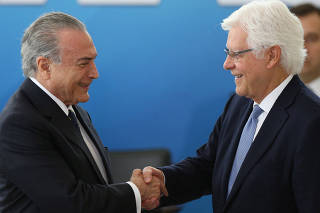 Brazil's President Michel Temer greets the Minister of the General Secretary of the Presidency of Brazil, Wellington Moreira Franco during  the inauguration ceremony of the new Ministers, at the Planalto Palace in Brasilia