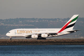 FILE PHOTO: Emirates Airbus A380-800 takes off from San Francisco International Airport, San Francisco