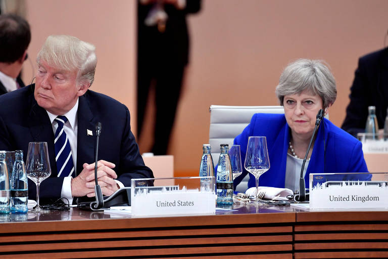 O presidente dos EUA, Donald Trump, e a primeira-ministra britânica, Theresa May, na cúpula do G20