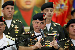 Venezuela's DefenCe Minister Vladimir Padrino Lopez talks to the media during a news conference in Caracas