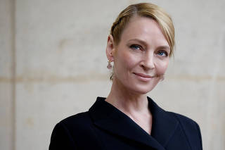 Actress Uma Thurman poses during a photocall before French fashion house Christian Dior Fall/Winter 2017-2018 women's ready-to-wear collection during Fashion Week in Paris
