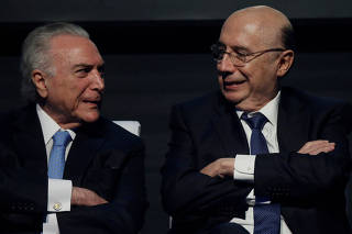 Brazil's President Michel Temer talks with Brazil's Finance Minister Henrique Meirelles during an event Caixa 2018 of Caixa Economica Federal bank in Brasilia