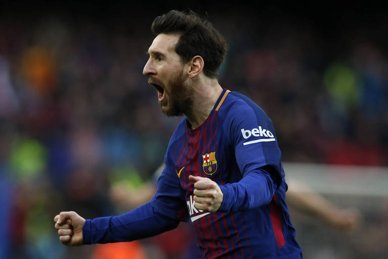 Com os braços esticados e soltando um grito de alegria, Messi comemora o gol do Barcelona sobre o Atlético de Madri