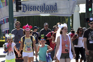 Tourists at Disneyland in Anaheim, Calif.