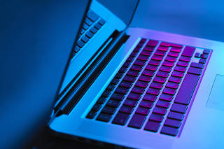 Laptop on office desk at night