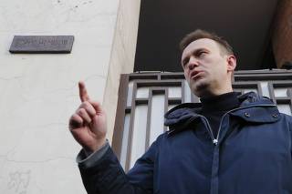 Russian opposition leader Navalny delivers a speech near a commemorative plaque in honour of slain Russian opposition figure Nemtsov during a ceremony in Moscow