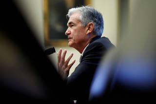 FILE PHOTO: Federal Reserve Chairman, Powell, delivers the semi-annual Monetary Policy Report in Washington