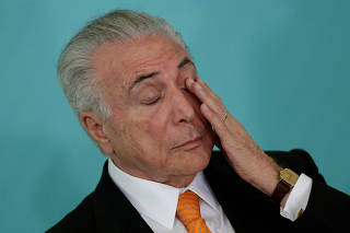Brazil's President Michel Temer gestures during a meeting of the Council for Economic and Social Development (CDES) at the Planalto Palace in Brasilia