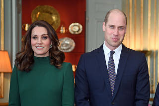Britain's Prince William and Catherine, the Duchess of Cambridge arrive to meet Sweden's royal family  at the Royal Palace of Stockholm