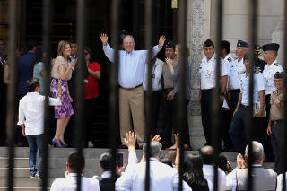 Peru's outgoing President Pedro Pablo Kuczynski greets palace staff members after resignation, at the Government Palace in Lima