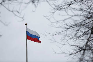 A Russian flag flies atop the Consulate General of the Russian Federation in Seattle