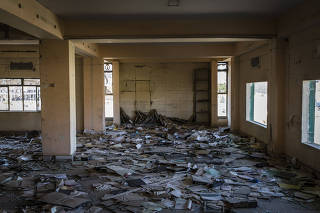 Paperwork litters the remains of the bombed-out Ministry of Agriculture, which was occupied by the Islamic State, in Mosul, Iraq.