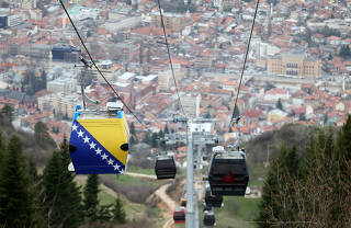 The Trebevic cable car is seen above the city of Sarajevo during a test drive following the restoration of the line after 26 years