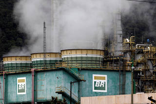 Smoke billows from tanks of Brazil's state-run Petrobras oil company at Presidente Bernardes Refinery in Cubatao