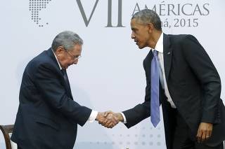 Obama shakes hands with Castro as they hold a bilateral meeting during the Summit of the Americas in Panama City