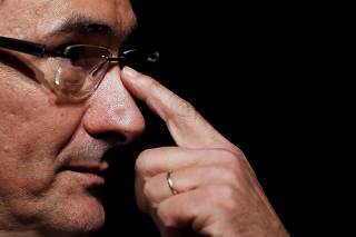 Brazil's new Finance Minister Guardia looks on during his handover ceremony for the new Financial Minister in Brasilia