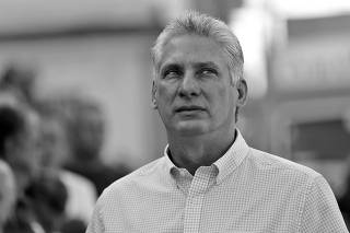 Cuba's First Vice-President Miguel Diaz-Canel stands in line before casting his vote during an election of candidates for the national and provincial assemblies, in Santa Clara