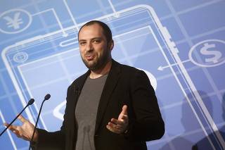 WhatsApp CEO and co-founder Jan Koum delivers a speech at the Mobile World Congress in Barcelona