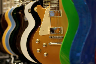 FILE PHOTO: Gibson guitars are displayed at a music store in Singapore