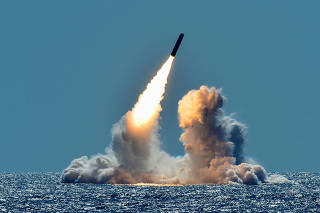 An unarmed Trident II D5 missile is test-launched from the ballistic missile submarine USS Nebraska