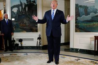 U.S. President Donald Trump reacts to a question from the media after announcing his intention to withdraw from the JCPOA Iran nuclear agreement at the White House in Washington