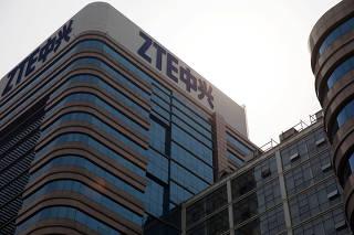 FILE PHOTO: The logo of ZTE Corp is seen on its building in Beijing