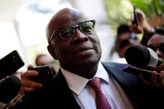 FILE PHOTO: Joaquim Barbosa, former Chief Justice in Brazil, is seen before a meeting with PSB Election Commission in Brasilia