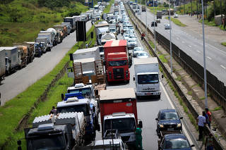 Truck owners block the BR-324 highway during a protest against high diesel prices in Simoes Filho near Salvador