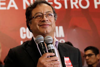 Colombian presidential candidate Gustavo Petro speaks to supporters from the Liberal Party during a meeting at a hotel in Bogota